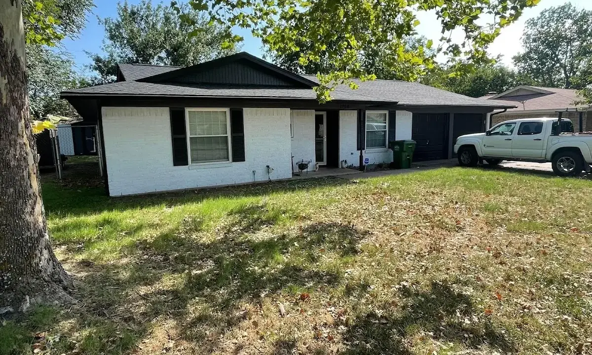 Professional roofing crew working on a residential roof in Sleepy Hollow